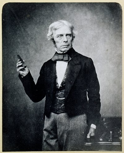 Michael Faraday (1791-1867) pitelemässä magneettipalkkia, Maull ja Polyblank. tekijältä English Photographer