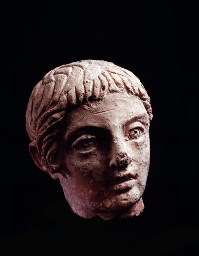 Etruskien sivilisaatio: nuoren miehen pää Belvederen temppelistä Orvietossa - 5.-4. vuosisadalla eKr. Halkaisija 13 cm tekijältä Etruscan