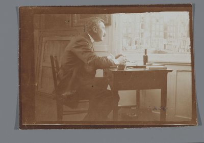 Willem Witsen työpöydän ääressä veneessään tekijältä George Hendrik Breitner