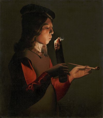 Nuori poika, jolla on piippu, puhaltaa tulipaloa, kirjoittanut La Tour, Georges, de (1583-1652). öljy kankaalle tekijältä Georges de La Tour