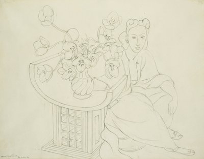 Istuva nainen ja maljakko tulppaanin kanssa tekijältä Henri Matisse