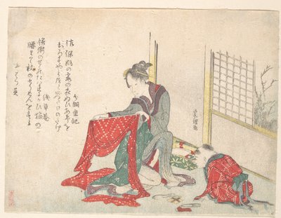 Nainen taittaa kangasta tekijältä Katsushika Hokusai