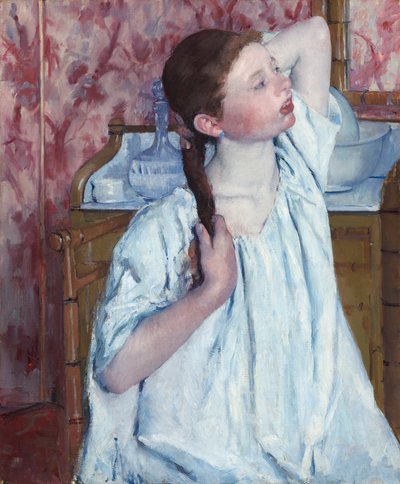 Tyttö järjestää hiuksiaan tekijältä Mary Cassatt