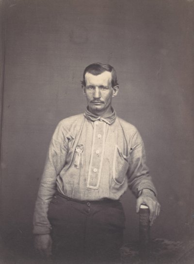 Mies, jolla on patenttiviraston kirja, n. 1857. tekijältä Oliver H. Willard.