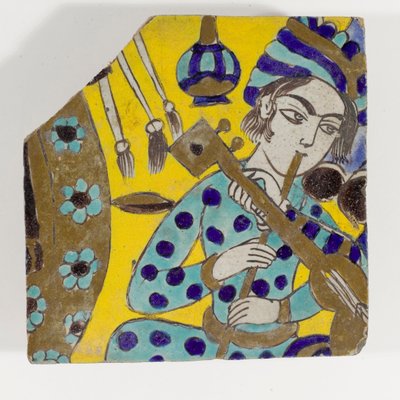 1600-luvun lopun Safavid Persia cuerda seca -keramiikkalaatta, joka kuvaa miestä soittamassa huilua turbaanissa tekijältä Persian School