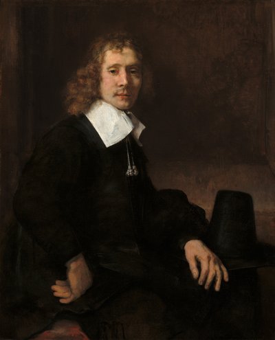 Nuori mies istumassa pöydän ääressä, mahdollisesti Govaert Flinck, c. 1660. tekijältä Rembrandt van Rijn