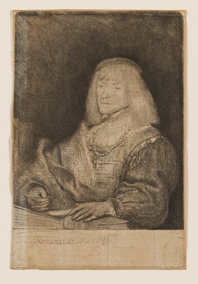 Mies työpöydän ääressä, jolla on kaulassaan risti ja ketju tekijältä Rembrandt van Rijn