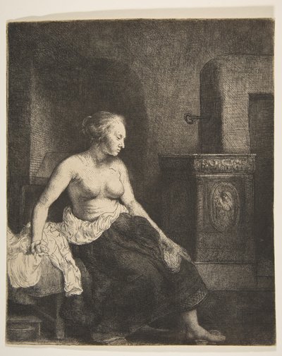 Nainen istuu puolipukeutuneena lieden vieressä, 1658. tekijältä Rembrandt van Rijn