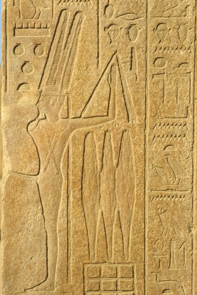 Muinainen Egypti, seinämaalaus/kaiverrus, Min-jumala, Karnakin temppeli, Luxor, hedelmällisyyden jumala, pitelee ruoskaa (kuva) tekijältä School Egyptian