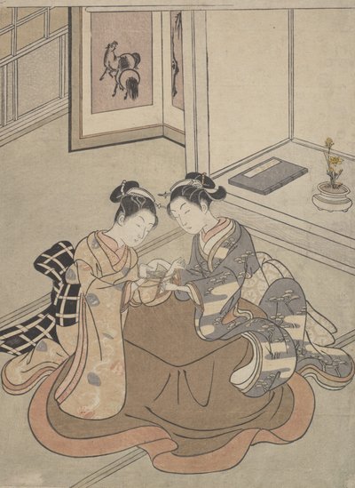 Kaksi nuorta naista istuvat Kotatsu Playing Cat