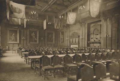 Lippuriippuva suuri sali, jossa voimakas elintarvikekauppiaiden yritys pitää juhlansa, vuodelta 1935. tekijältä Unbekannt