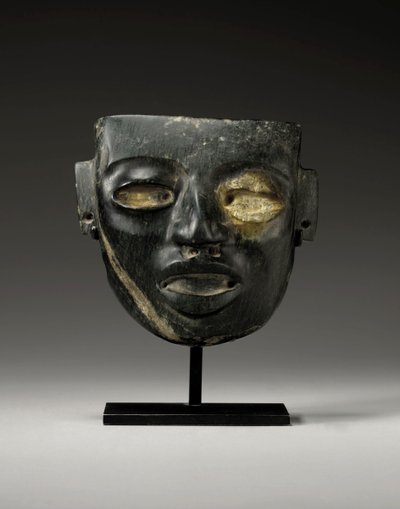 Teotihuacan-kivinaamio, johon on kaiverrettu arvohenkilön nuorekkaat kasvot, n. 450-650 tekijältä Unbekannt