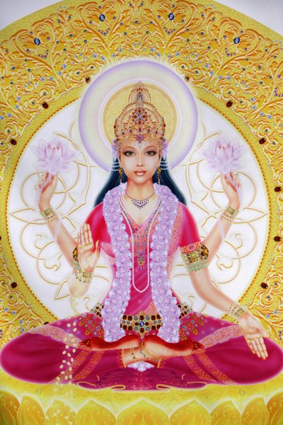 Kuvassa Lakshmi, vaurauden jumalatar ja Lord Vishnun puoliso istumassa lootuskukkien kanssa tekijältä Unbekannt