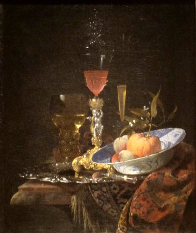 Viinilasi ja kulhollinen hedelmiä tekijältä Willem Kalf