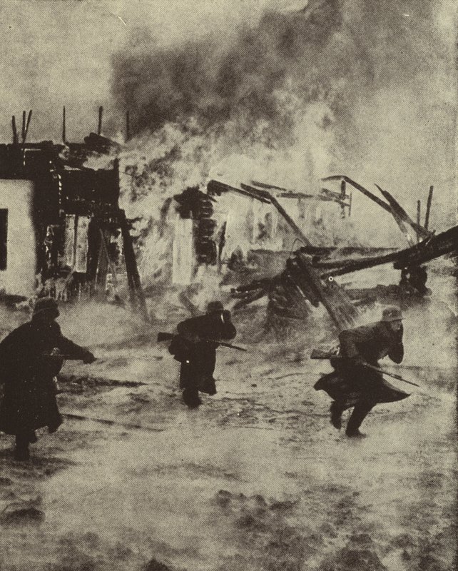 Saksalaiset sotilaat etenevät Rotterdamin palavien raunioiden läpi Luftwaffen pommituksen jälkeen, toinen maailmansota, toukokuu 1940 (m/v kuva) tekijältä Photographer German