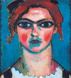 Nuori nainen, jolla on vihreät silmät, n. 1910