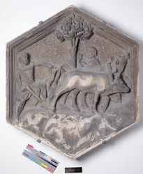 The Art of Agriculture, kuusikulmainen koristeellinen kohokuviolaatta sarjasta, joka kuvaa taiteen ja tieteiden harjoittajia, mahdollisesti perustuen Giotton (n. 1266-1337) n. 1334-1348 (marmori) suunnitelmiin