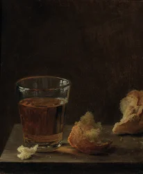 Lasi olutta ja sämpylä pöydällä