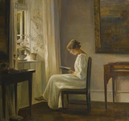 Sisustus, jossa nainen lukee