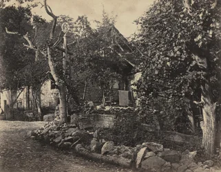 Maaseutumaisema kivirakennuksella ja ristillä, n. 1857.