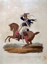 10. korpraali eli Walesin prinssin omat kuninkaalliset hussarit arvostelujärjestyksessä, teoksesta "British Imperiumin armeijan puvut, viimeisten säännösten mukaan 1812", kaiverruksen on tehnyt J.C. Stadler, pubi