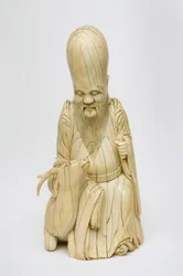 Shou Xingin kaiverrettu norsunluuhahmo istuu peuran kanssa, n. 1580-1644