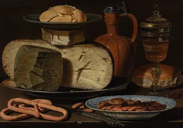 Asetelma, jossa on juustoja, manteleita ja rinkeleitä, noin 1615