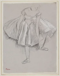 Danseuse rajustant poika chausson