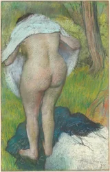 Junge Frau beim Ankleiden