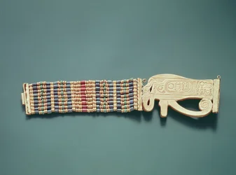 Joustava helmirannekoru, Tutankhamonin haudasta, Uusi valtakunta (kultaa ja karneolia, kulta-, fayanssi- ja lasihelmiä) (ks. myös 391012-13).