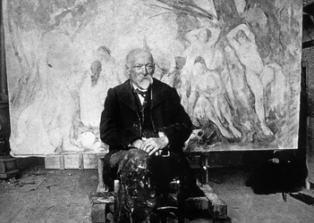 Paul Cézanne (1839-1906), ranskalainen taidemaalari, vuonna 1904 yhden uimareita esittävän maalauksensa edessä