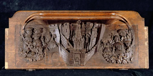 Kurjuus, joka kuvaa muurien ympäröimää kaupunkia, jossa on portti, jossa on kohotettu portti, New College Chapel, Oxford, 1300-luvun loppu (puuta)