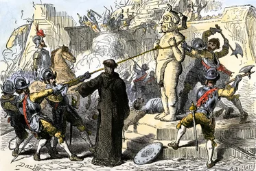 Espanjalaiset papit tuhoavat Meksikon asteekkien epäjumalia. 1800-luku (värillinen kaiverrus)