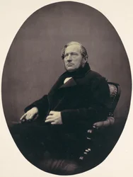 [Nojatuolissa istuva mies], 1850-60-luku.