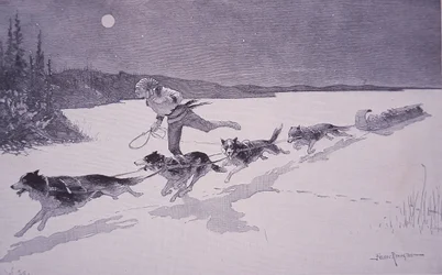 French Fur Trapper Kanadassa Husky-koirien kanssa jäätyneellä järvellä