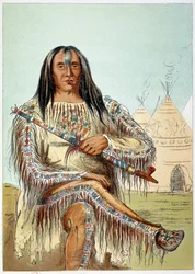 Amerikan intiaanit: Blackfoot-heimon (mustat jalat) noin 50-vuotiaan johtajan muotokuva. George Catlinin (1794-1872) kuvitus