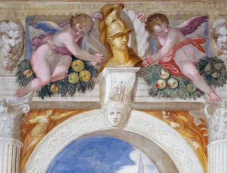 Putti, jossa on sankarin rintakuva maskaroiden ja hedelmäjuhlien keskellä.