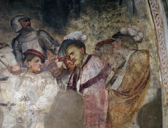 Sotilas panssaripukeutuneena ja miehet hattuja, yksityiskohta Girolamo Romaninon (n. 1484-1562 jälkeen) freskosta, Brenon Pyhän Antoniuksen Abbotin kirkon presbyterian vasen seinä. Italia