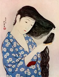 Hiuksiaan kampaava japanilainen nainen, 1920 1930.
