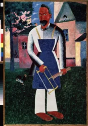 Kesäinen asukas. (Kesäasukka). Kesällä maalaiskylän edessä muotokuva puusepistä, avojaloin, esiliinassa työkaluja pitelemässä. Maalaus: Kasimir Severinovich Malevitch (Malevich, Malevic) (1878-1935), öljy puulle
