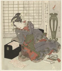 Geisha nojaa shamisenin laatikkoon