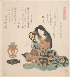 Tsuzumia soittava nainen