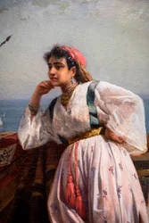 Nuori itämainen tyttö terassilla Algerissa
