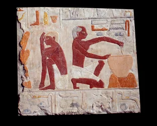 Muinainen egyptiläinen taide: leivän leivonta. Yksi mies tekee kakkutahnaa, toinen valvoo leipämuottien paistamista. Kalkkikivi (2500-2350 eKr.) 5. dynastia. Pariisi, Musee du Louvre