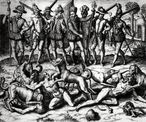 Vasco Núñez de Balboan (1475-1571) koirat hyökkäävät intiaanien kimppuun
