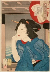 Viileä: 1870-luvun puolivälin geisha istumassa veneessä