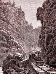 Juna ylittää Coloradon vuoret. Yhdysvallat vuonna 1886 (kaiverrus).