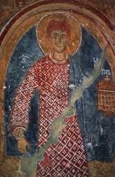 Pyhimyksen hahmo, fresko Pyhän Nikolauksen kappelissa (11.-15. vuosisata), Mottola, Apulia, Italia.